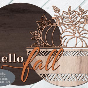 Fall Door Hanger SVG Laser Cut File with a Pumpkin Welcome Sign SVG theme including a trio of pumpkins and fall leaves in a basket for use with your Glowforge, XTool and other laser machines.