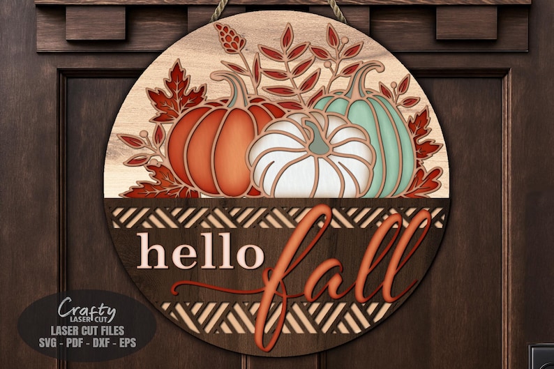 A Floral Pumpkin Welcome Sign SVG Laser Cut File with a Hello Fall Door Hanger SVG theme including a trio of pumpkins and fall leaves in a basket for use with your Glowforge, XTool and other laser machines.
