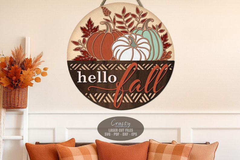 A Hello Fall Door Sign SVG Laser Cut File with a Pumpkin Welcome Sign SVG theme including fall leaves in a basket for use with your Glowforge, XTool and other laser machines.