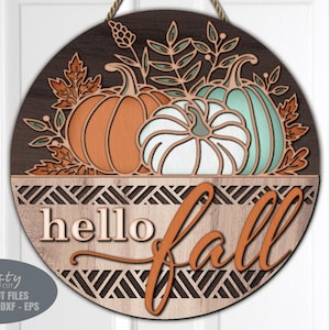 A Fall Pumpkin Door Hanger SVG Laser Cut File with a Floral Welcome Sign SVG theme including a trio of pumpkins and Hello Fall lettering for use with your Glowforge, XTool and other laser machines.