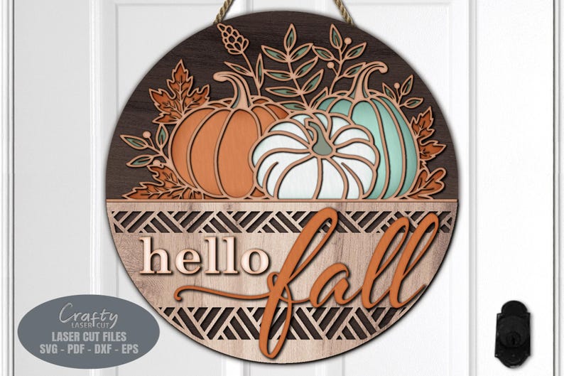 A Fall Pumpkin Door Hanger SVG Laser Cut File with a Floral Welcome Sign SVG theme including a trio of pumpkins and Hello Fall lettering for use with your Glowforge, XTool and other laser machines.