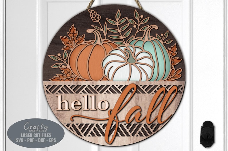 A Hello Fall Door Hanger SVG Laser Cut File with a Floral Pumpkin Welcome Sign SVG theme including a trio of pumpkins and fall leaves in a basket for use with your Glowforge, XTool and other laser machines.