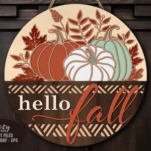 Pumpkin Door Hanger SVG Laser Cut File with a Floral Hello Fall Welcome Sign SVG theme including a trio of pumpkins and fall leaves in a basket for use with your Glowforge, XTool and other laser machines.