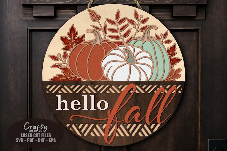 Pumpkin Door Hanger SVG Laser Cut File with a Floral Hello Fall Welcome Sign SVG theme including a trio of pumpkins and fall leaves in a basket for use with your Glowforge, XTool and other laser machines.