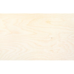 May include: A close-up of a light wood surface with a natural grain pattern.