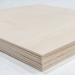 May include: A stack of light brown plywood sheets.