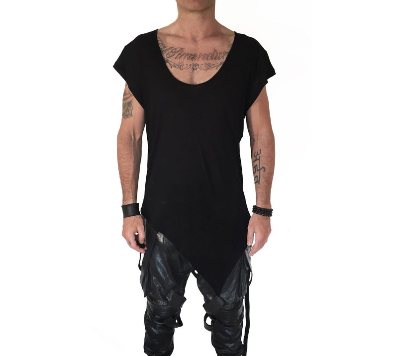 May include: Black asymmetrical t-shirt with short sleeves and a scoop neck.