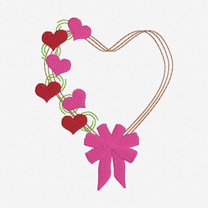 May include: A heart-shaped wreath with a pink bow and pink and red hearts. The wreath is made of brown twigs.