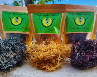 May include: Three pouches of St. Lucian Sea Moss, each labeled "Nefer Kali Healing." The sea moss is displayed in three colors: dark green, golden yellow, and deep purple. Each pouch is labeled with "4 oz."
