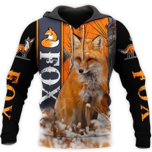 May include: A black hoodie with an orange and black fox print. The hoodie has a large fox graphic on the front and the word "FOX" printed on the sleeves.