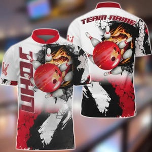May include: White bowling shirt with red accents, featuring a bowling ball and pins graphic. The shirt has the name "JOHN" vertically down the front and "TEAM-NAME" across the back. The design includes a fiery background and a cracked effect.