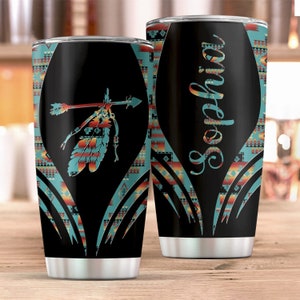 May include: Two stainless steel tumblers with a black background and a turquoise, red and yellow geometric pattern. One tumbler has the name "Sophia" on it, and the other has a stylised arrow and feather design.