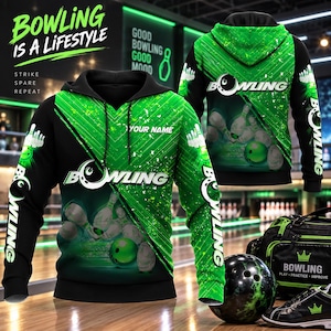 May include: A black and green hooded sweatshirt featuring a bowling theme with graphics of bowling balls and pins. The text "BOWLING IS A LIFESTYLE", "STRIKE SPARE REPEAT", "YOUR NAME", and "BOWLING" are printed on the fabric in white and green.