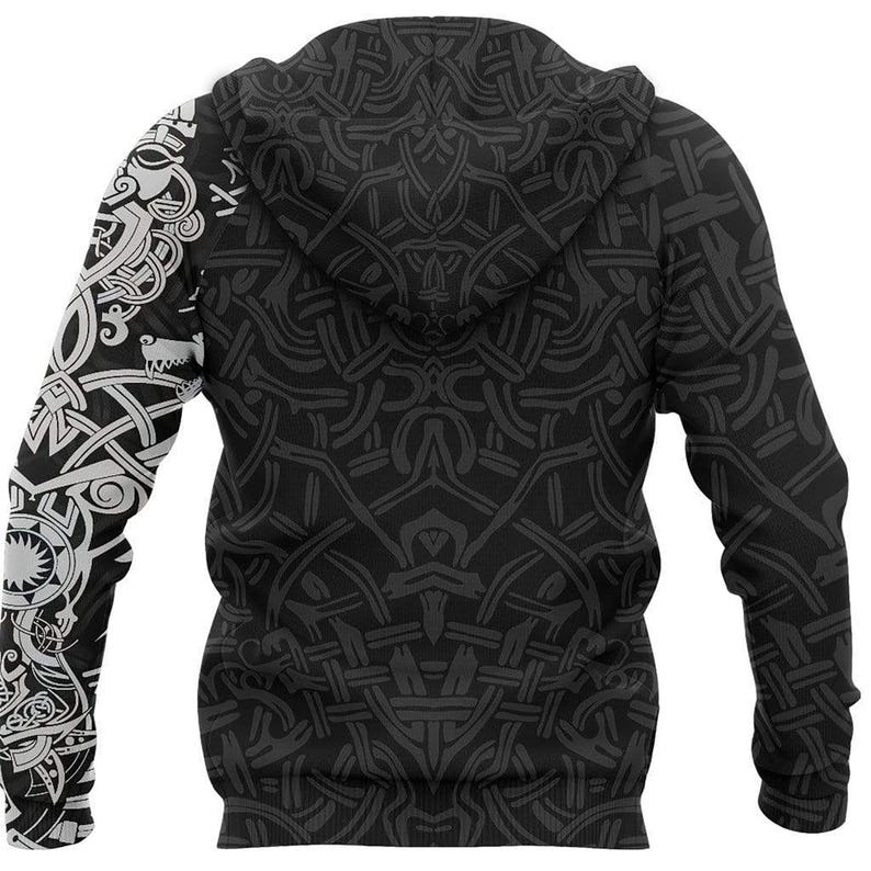 May include: A black hoodie featuring a dark grey, intricate, repeating knotwork pattern across the back and hood. The left sleeve displays a contrasting white, detailed graphic of a stylized animal head and complex interwoven geometric designs.