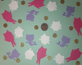 May include: A collection of pink, purple, and white paper cutouts of mermaids and coins. The mermaids have tails and are in various poses. The coins are gold and scattered around the mermaids.