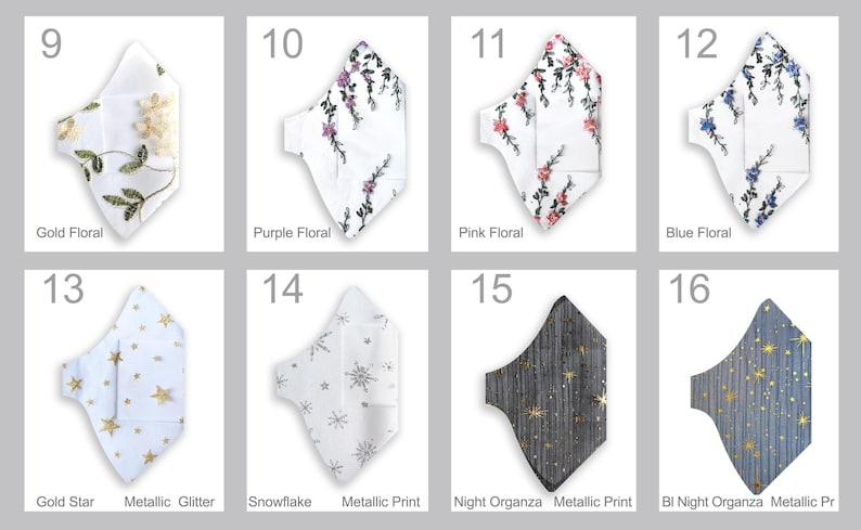 May include: Collection of face masks with various designs. Includes white masks with gold floral, purple floral, pink floral, and blue floral patterns. Other masks feature gold stars, snowflakes, and metallic prints. The last two masks have a night organza design.