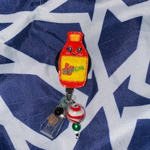 Hot sauce badge reel