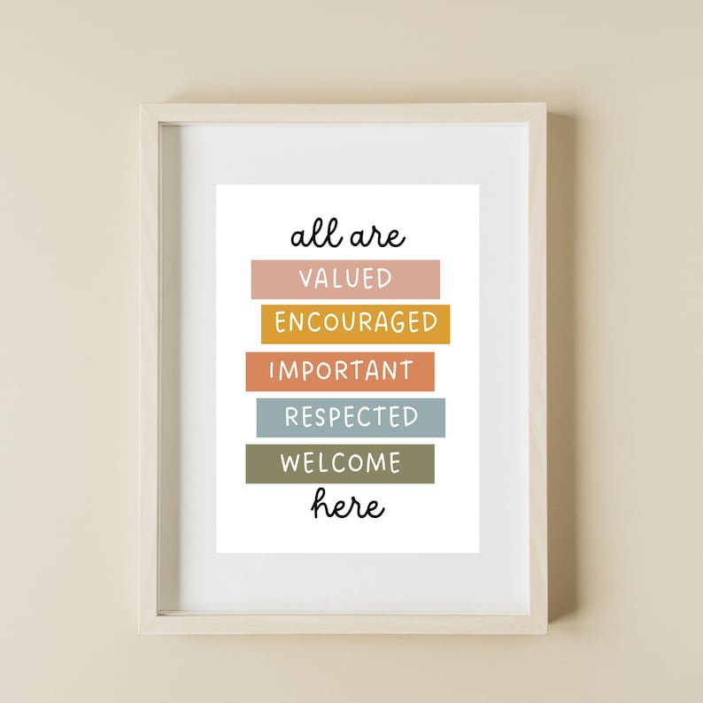 May include: A framed print with the text "all are valued encouraged important respected welcome here" in black lettering on a white background. The words are stacked vertically and each word is on a colored rectangle. The colors of the rectangles are peach, yellow, orange, blue, green, and brown.