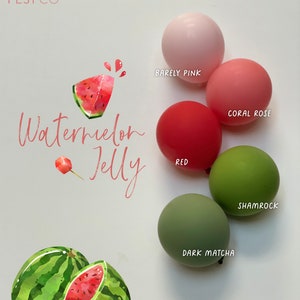 May include: Watermelon Jelly themed balloons in various colors, including red, green, pink, and coral. The balloons are arranged in a circle around a watercolor illustration of a watermelon.