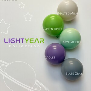 May include: Five round balloons in different colors and patterns. The balloons are labeled with the following names: Malted Milk, Green Apple, Keylime Pie, Violet, and Slate Gray. The balloons are arranged in a semi-circle on a white background. The text "POP FEST CO" and "LIGHTYEAR Collection" is visible in the top left corner of the image.