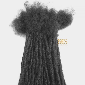 May include: A bundle of black human hair dreadlocks. The dreadlocks are long and thick, and they are arranged in a loose, messy style. The dreadlocks are perfect for adding length and volume to your hair.