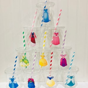 May include: Set of clear plastic cups with colorful striped straws and princess dress stickers. The stickers feature various Disney princesses, including Cinderella, Belle, and Ariel.