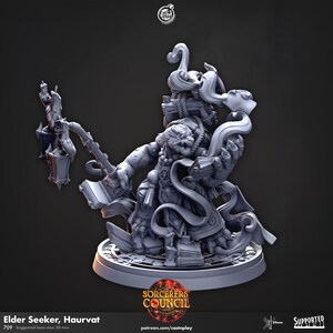 May include: A gray 3D-printed miniature of the Elder Seeker, Haurvat, holding a lantern and a book. The figure has a detailed design with swirling elements and is mounted on a circular base. The Sorcerers Council logo is visible.