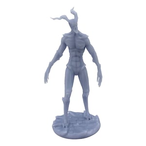 May include: A gray 3D printed miniature of a humanoid figure with antlers and a detailed, textured surface. The figure is standing on a round base.