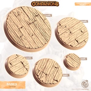 May include: A set of wooden bases for miniature figures in various sizes, including 15mm, 25mm, 30mm, 35mm, and 50mm. The bases are made of a light brown wood with a textured surface.