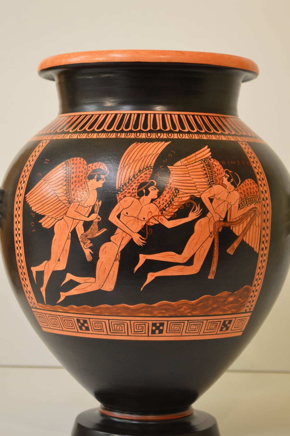 red and black greek pottery