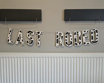 Last Rodeo Cow Print Banner