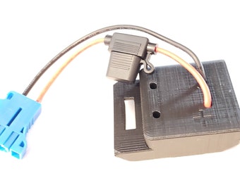 May include: A black 3D printed connector with a blue connector on a white background. The black connector has two holes and a slot. The blue connector has a series of pins.