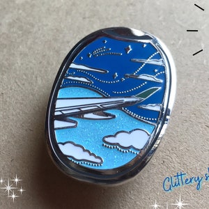 WINDOW SEAT, Airplane, Day Sky, Teal Green Wingtip, World Traveler Collection, Enamel Pin