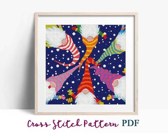 May include: Cross stitch pattern featuring six colorful gnomes with white beards, wearing striped hats, against a dark blue background with white snowflakes.