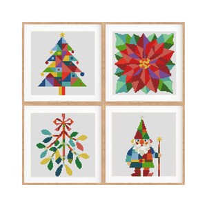 May include: A set of four square cross-stitch patterns framed in light wood. The designs feature a geometric Christmas tree, a red poinsettia flower, a sprig of mistletoe with a red bow, and a gnome holding a staff, all rendered in vibrant colours.