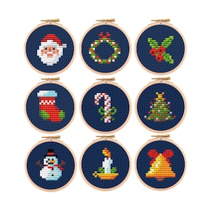 May include: Nine cross-stitch Christmas ornaments in wooden hoops. Designs include Santa Claus, a wreath, holly, a stocking, a candy cane, a Christmas tree, a snowman, a candle, and a bell. Each design is on a dark blue background.