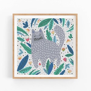 May include: A cross-stitch pattern featuring a gray cat surrounded by colorful flowers and leaves on a white background.