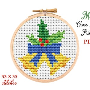 May include: A cross stitch pattern for a Christmas bell with a holly sprig and a blue bow. The pattern is 33 x 33 stitches and is available as a PDF download. Mini Cross Stitch Pattern PDF.