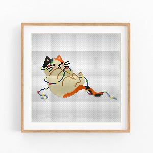 May include: Cross-stitch art of a calico cat tangled in colorful Christmas lights. The cat is depicted in shades of cream, orange, black, and white. The artwork is framed in a light brown wooden frame, perfect for home decor.
