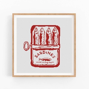 May include: Red and white cross-stitch pattern of a can of sardines. The can has a red label with the words "SARDINES - IN OLIVE OIL" on it. There are five sardines inside the can.