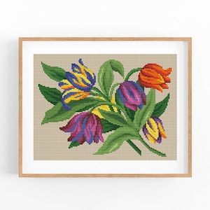 May include: A framed cross-stitch embroidery featuring a bouquet of colorful tulips in shades of purple, yellow, orange, and green.