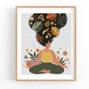May include: A cross-stitch pattern featuring a woman meditating with colorful abstract shapes and leaves above her head.