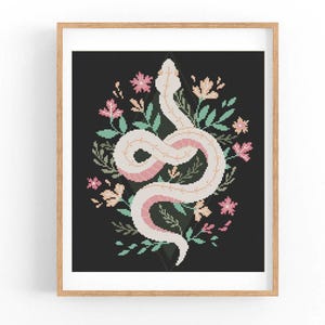 May include: White snake with pink accents curled around a cluster of pink, green, and white flowers on a black background.