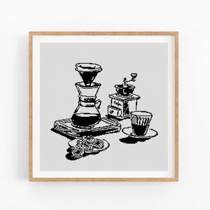 May include: Monochrome illustration of a coffee-making scene, featuring a pour-over, grinder, cup, and pastries. The image is framed in a light brown wooden frame, suitable for a kitchen or dining area.
