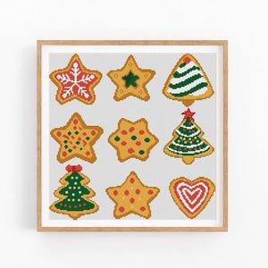 Puede incluir: Nueve galletas de jengibre con temática navideña, incluyendo estrellas, árboles y un corazón, con varias decoraciones de glaseado rojo, verde y blanco.