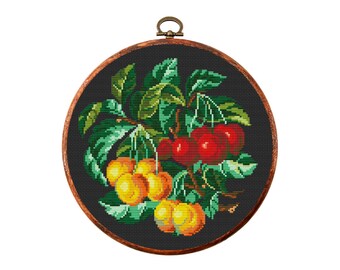 May include: A round embroidery hoop with a black background and a colourful cross-stitch design of a branch with red cherries and yellow peaches.