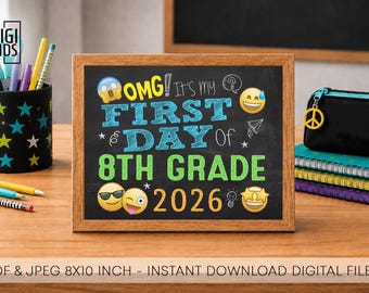 May include: A rectangular chalkboard sign in a wooden frame featuring colourful text that reads OMG! It's my FIRST DAY Of 8TH GRADE 2026. The design includes various yellow and blue emojis, white line drawings, and stars on a black background.