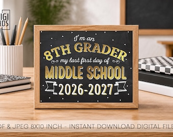 May include: A rectangular wooden frame containing a black chalkboard sign with gold text that reads: I'm an 8TH GRADER my last first day of MIDDLE SCHOOL 2026-2027. The sign features white decorative accents and is displayed on a wooden desk surface.