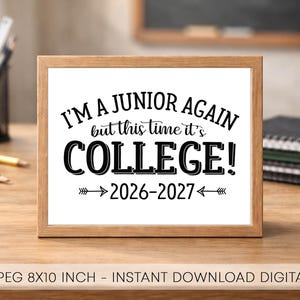 May include: A rectangular wooden frame containing a white sign with black text that reads I'M A JUNIOR AGAIN but this time it's COLLEGE! 2026-2027 with arrow graphics. The sign is an 8x10 inch digital file available as a PDF and JPEG format.