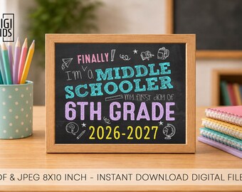 May include: A rectangular wooden frame containing a chalkboard sign with the text FINALLY! I'm a MIDDLE SCHOOLER my first day of 6TH GRADE 2026-2027 in colorful chalk-style lettering, surrounded by small hand-drawn icons of school supplies.
